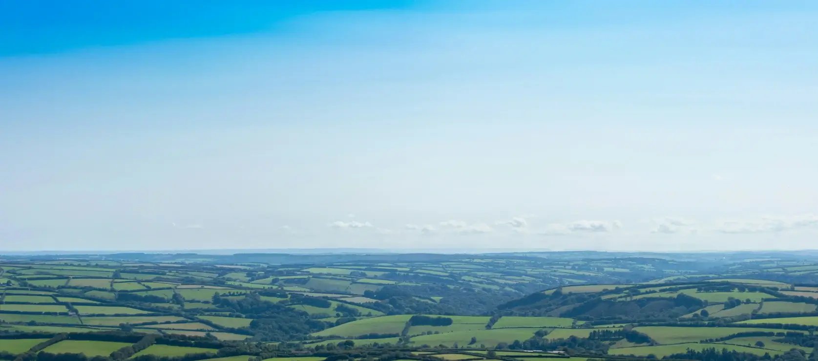 Landscape photo of Bridgwater, Somerset with lots of greenery and blue skies